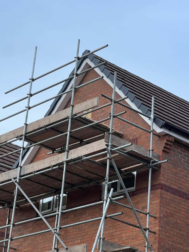 This is a photo of a roof which has just been repaired. There is a scaffold located at the gable end for access onto the roof. Works carried out by LS Roofing Chalfont St Giles