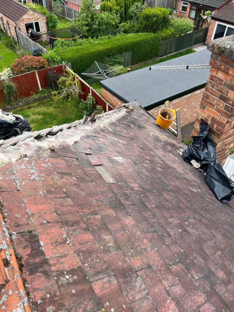 This is a photo of a roof where the hip tiles have been removed, and are just about to be replaced. Works carried out by LS Roofing Chalfont St Giles