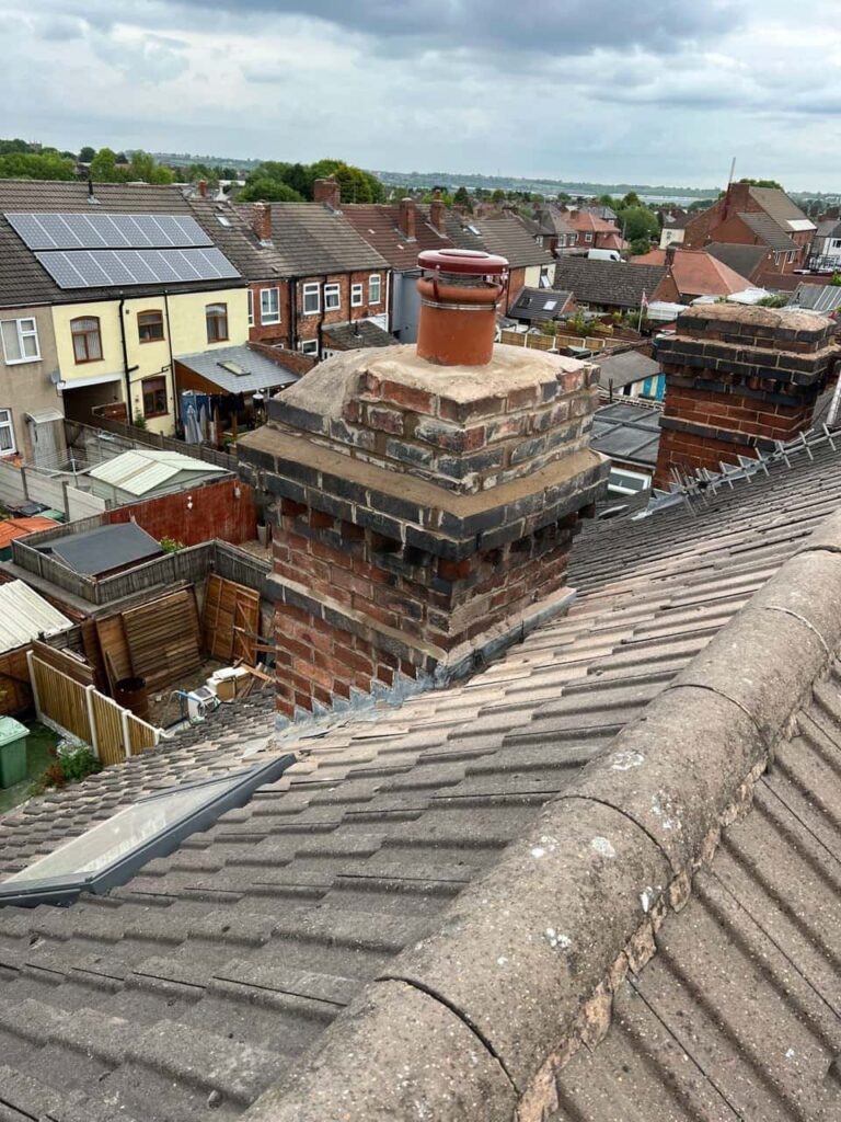 This is a photo taken from a roof which is being repaired by LS Roofing Chalfont St Giles, it shows a street of houses, and their roofs